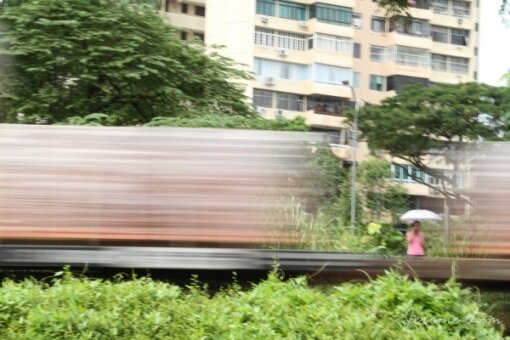 A train carrying bricks passing a popular shortcut from Jalan Anak Bukit to Rifle Range Road, one that would have been used by squatters living in the area.