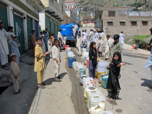 Non-government organisations distributing clean drinking water to the flood affected people in Swat.